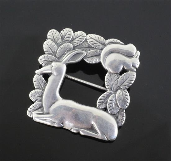 An Arno Malinowski for Georg Jensen sterling silver square squirrel and deer brooch, no. 318, 1933-1944 mark, 37mm.